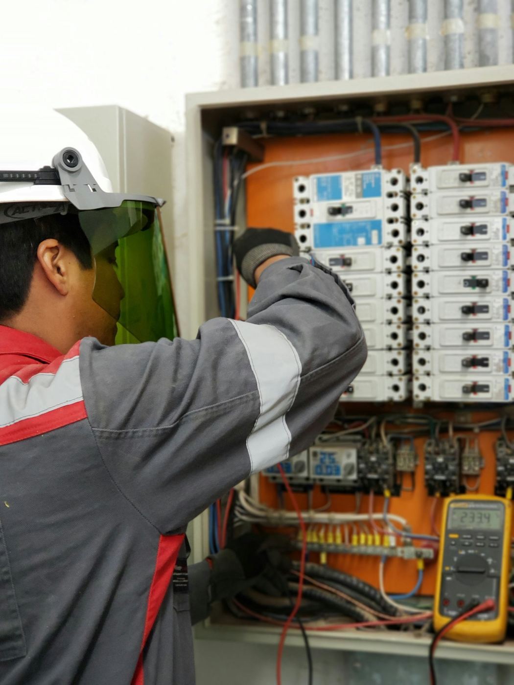 Technician working on an electrical DB panel in Singapore