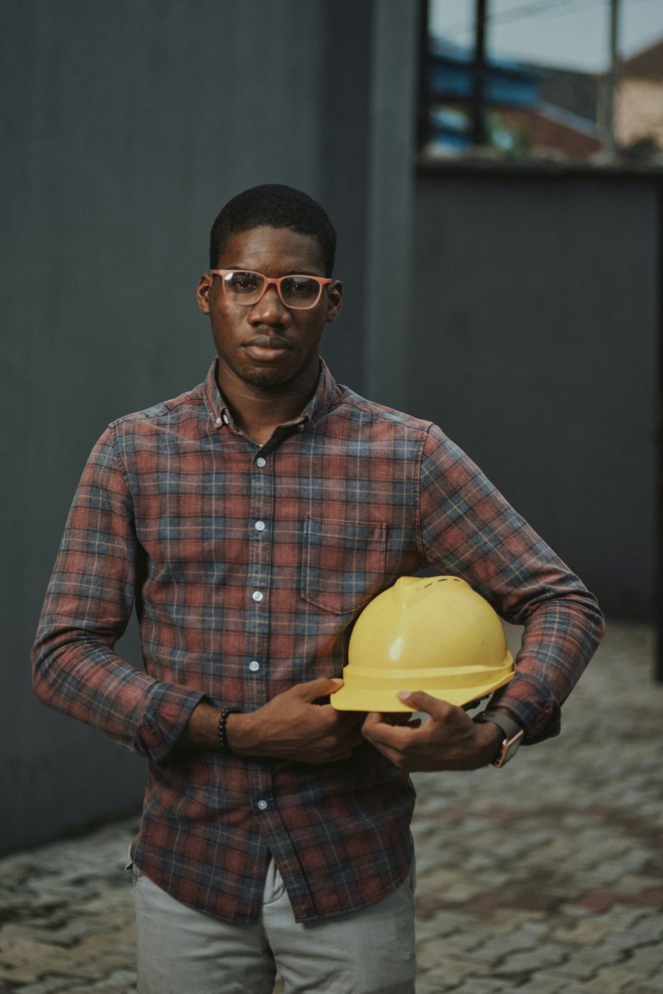 HandyTech technician holding a safety helmet